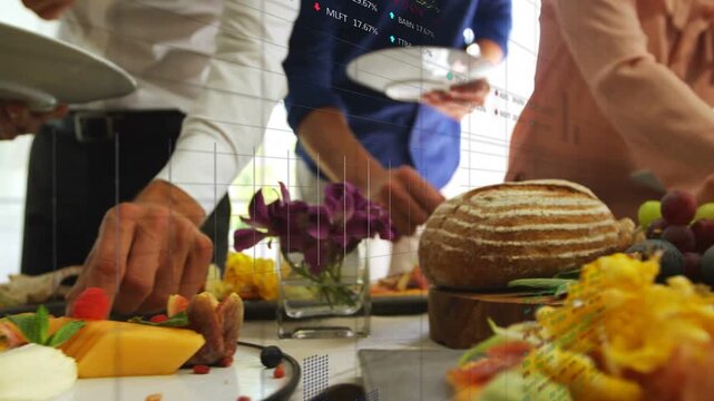 Colleagues presenting plates, serving themselves at business lunch buffet, selecting bread, fruit
