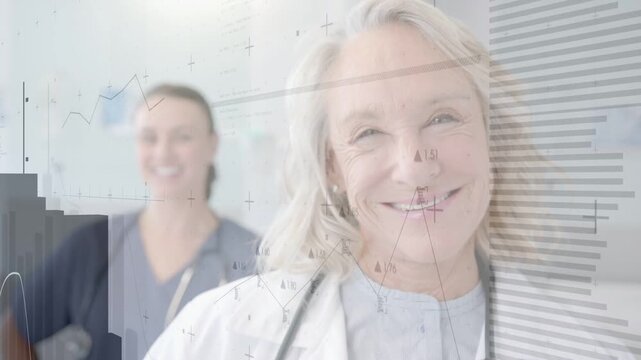 Senior clinician holding gaze while medical graphs fading, sweeping, showing patient data