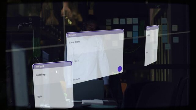 Man at desk, laptop booting, spawning UI panels hovering over him showing loading percent for tech