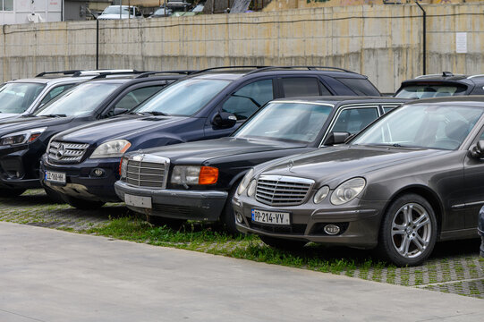 April 18, 2026, Tbilisi, Georgia Parking Lot with Cars Including Mercedes-Benz E-Class W211