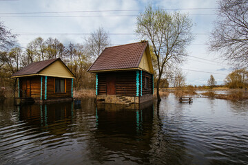 Fototapeta premium Flooded wooden rural houses. Concept of natural disaster