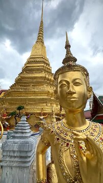 Grand Palace Golden Deity in Front of Golden Chedi (Bangkok, Thailand)