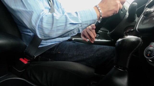 closeup of man inside a car while driving