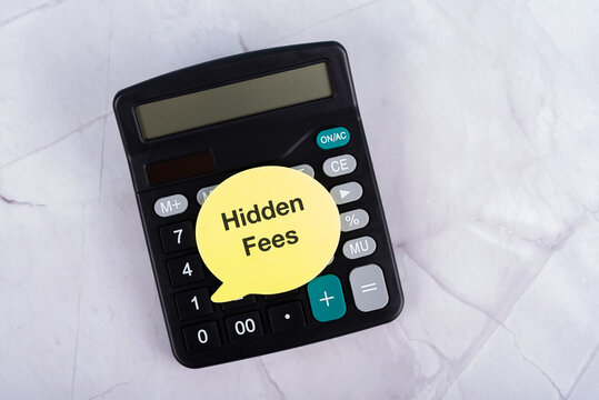 Calculator and paper note with text Hidden Fees