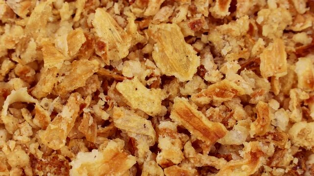 Organic crispy fried onions circle rotation close up top view