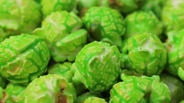 Bright green apple popcorn circle rotation close up