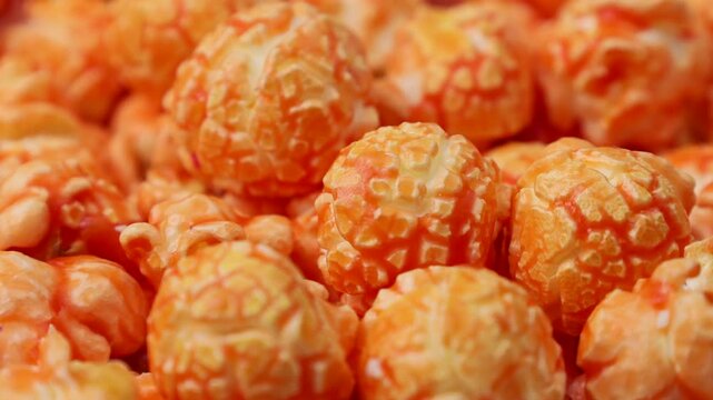 Bright orange fruit popcorn circle rotation close up