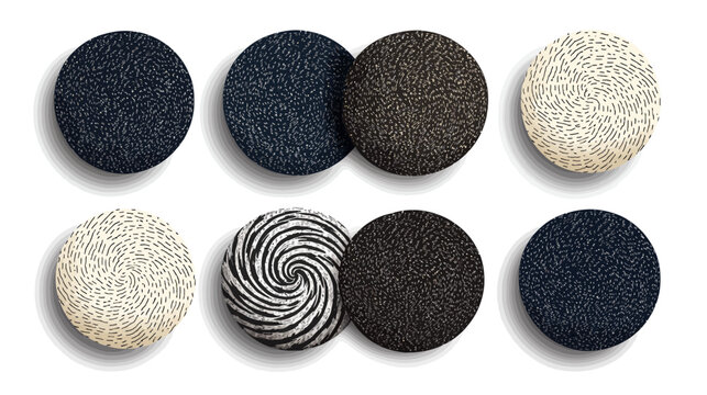 Eight textured circular objects with varying patterns and colors with drop shadows on a white background