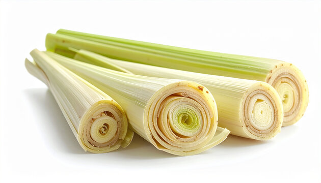Fresh lemongrass stalks displayed on a white surface for culinary or health concepts