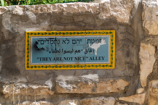 A  ceramic street sign on a wall in the Musrara neighborhood of Jerusalem marking &ldquo;They Are Not Nice Alley,&rdquo; named after by Golda Meir referring to Israeli Black Panthers protest movement