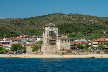Obraz premium An ancient Byzantine stone tower in Ouranoupoli, Chalkidiki, Greece.