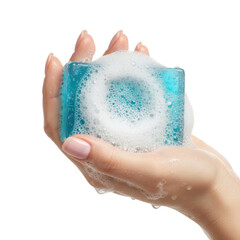 Fototapeta premium A youthful female hand with pink manicured nails holding a translucent blue soap bar with white suds in macro detail and soft lighting concept of purity