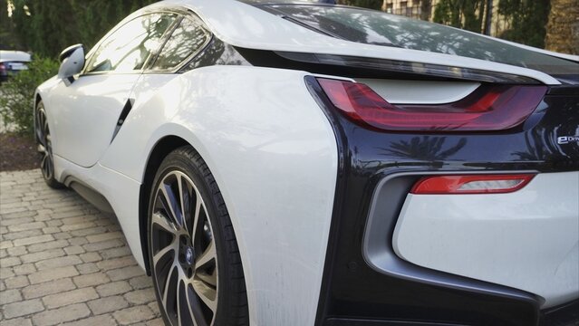Maspalomas, Las Palmas, Canary Islands, Spain - April 13, 2024 - BMW i8 parked on cobblestone, showcasing its modern design, sleek lines, and eDrive plug-in hybrid technology