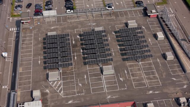 Solar Array on Car Park: An aerial view showcases rows of solar panels strategically placed atop a car park, symbolizing a commitment to renewable energy and sustainable practices.