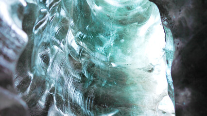 Ice crevasse with glacier rocks at vatnajokull mass, inside ice caves with transparent crashed icebergs. Spectacular blue icy blocks in arctic icelandic scenery, glacier hiking. Handheld shot. © DC Studio
