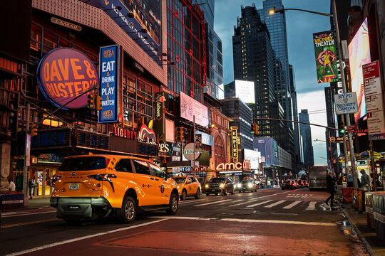 Vibrant Times Square Street Scene in New York City with Yellow Taxi
