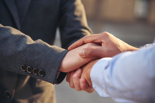 Business people shaking hands together. Group of Businesspeople Trust partner hands stack. Business partner team building Social Gathering teamwork. Man handshake Leader Trust team handshake promise