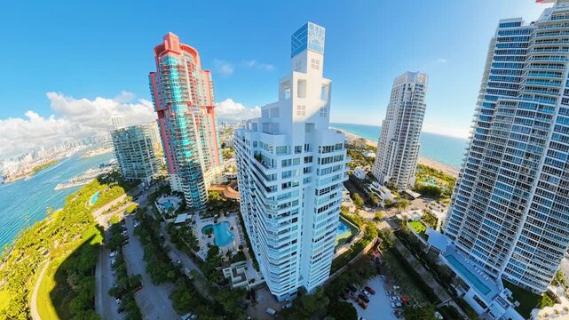 Aerial Miami flyby and pull out to warp reveal miniature earth world