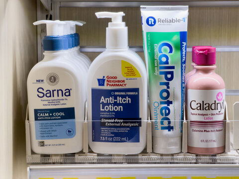 Sarna Gold Bond CalProtect And Caladryl Anti Itch Lotion And Skin Care Products On Pharmacy Shelf Display