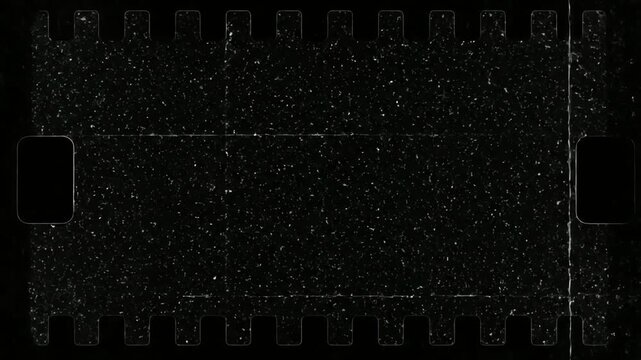 Vintage film grain overlay with perforations and light leaks, cinematic texture