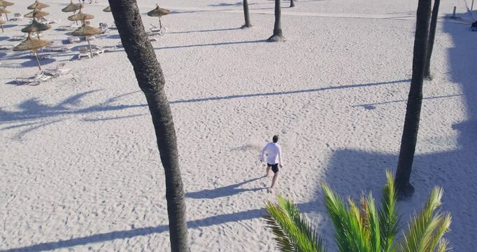 Man Running Happy on Playa de Muro Beach Mallorca