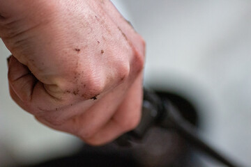 Fototapeta premium man with hand in soil