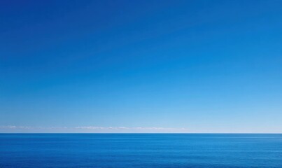 Fototapeta premium Vast blue sea under bright sky