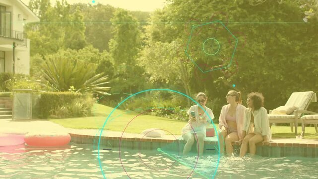 Three women leaning at pool edge, one angling phone sharing app content, HUD technology animating