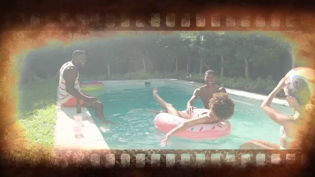 Left man starting toss, four friends playing beach ball, steadying pink donut float for leisure