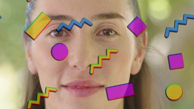 Small graphics appearing around female face, Memphis shapes pulsing, revealing smile for branding