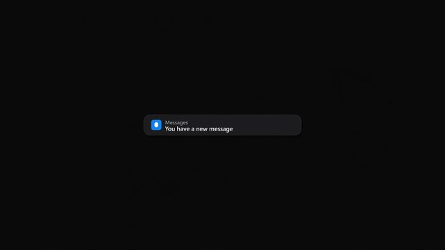 A modern digital message notification appears on a dark screen, expanding to display a new message with reply and dismiss options. The UI element then retracts, showing a smooth animation.