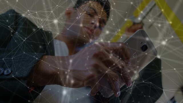 Commuter on train scrolling phone, yellow rail, node overlay pulsing, smiling checking messages