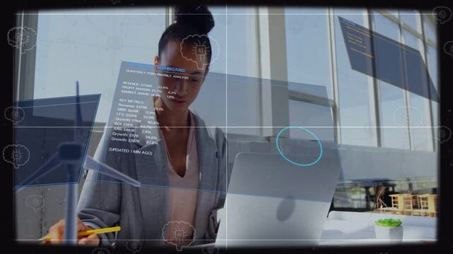 Female engineer tapping trackpad by window, AR dashboard appearing, annotating wind turbine plans