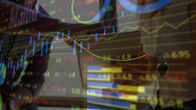 Woman exec tapping tablet, man exec pointing, causing candlesticks animating during finance review