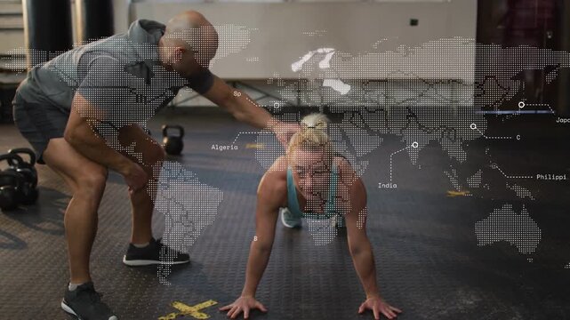 Coach cueing athlete doing pushups lowering chest and pushing up while guiding form for posture