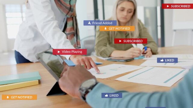 Team tapping tablet, pointing charts, causing badges to stack then fade for business review