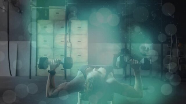 Female athlete performing dumbbell chest presses from arms-extended start, building chest strength