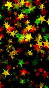 Stars floating down in bold red, yellow, and green colors on black background for Juneteenth, or Freedom Day, to commemorate the ending of slavery on June 19th 1865 in the United States of America.