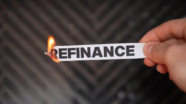 Burning &ldquo;REFINANCE&rdquo; concept symbolizing mortgage payoff, debt freedom, stable housing costs, and financial relief without loan restructuring or repeated refinancing.