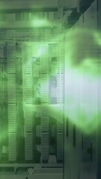 Vertical video: Green haze appearing on right, drifting across building facade, creating soft tint