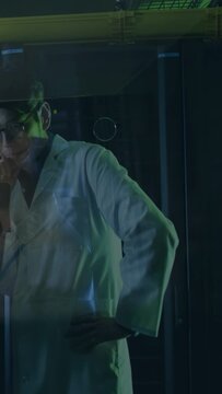 Vertical video: Scientist reacting after coworker gesture at lab glass, rubbing chin, fixing collar