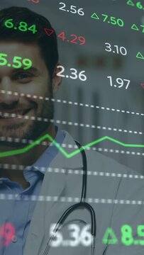 Vertical video: Market update causing doctor smiling while stethoscope showing and charts scrolling