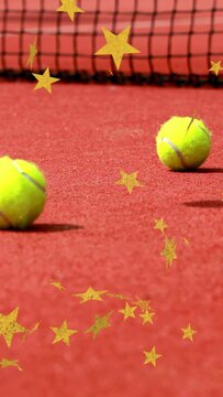 Vertical video: Ball coming right causing rolling, settling on clay, gold stars for sports