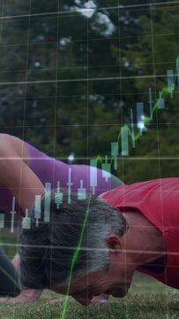Vertical video: Couple starting plank doing pushups as market charts overlaying 6