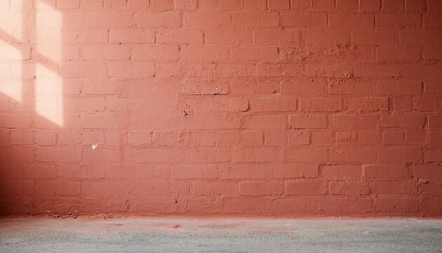 Textured Orange Brick Wall with Concrete Floor Surface Providing a Rustic Backdrop