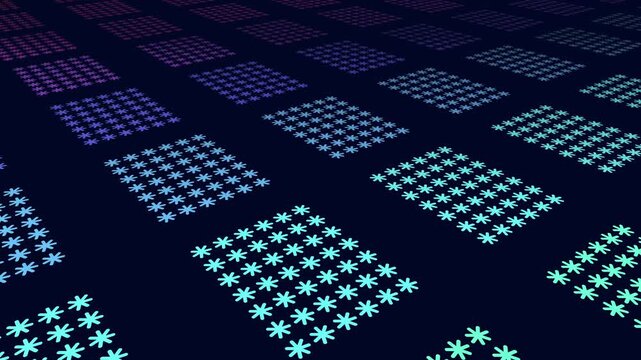 Abstract footage of repeating flower-like symbols arranged in colorful square tiles on a dark blue background, creating a modern geometric pattern for design and tech visuals