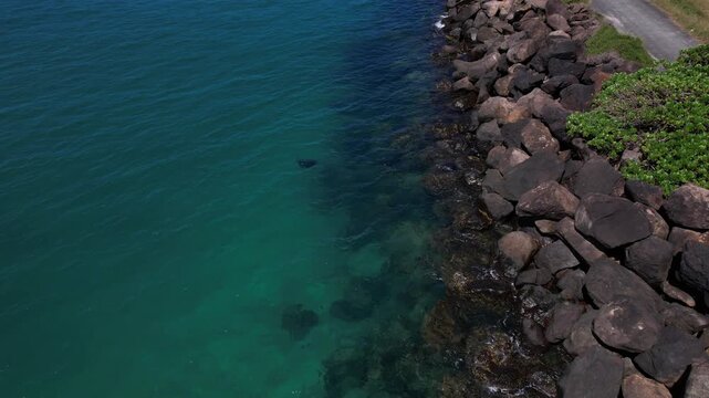 Stone Breakwater With Turquoise Swimming Basin At Marlo Beach In Fingal Head, New South Wales, Australia. Aerial Close-up Shot