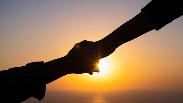 silhouette of a hand holding the sun