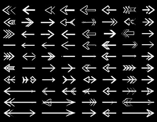 Obraz premium A collection of white arrows on a black background