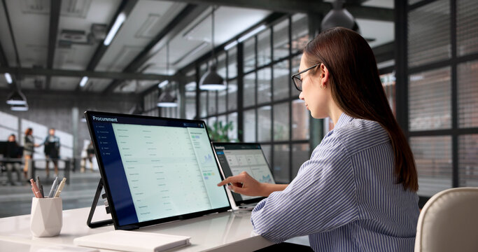Woman In Business Suit Uses Touchscreen